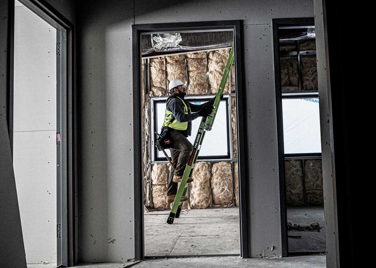 An electrician on a ladder