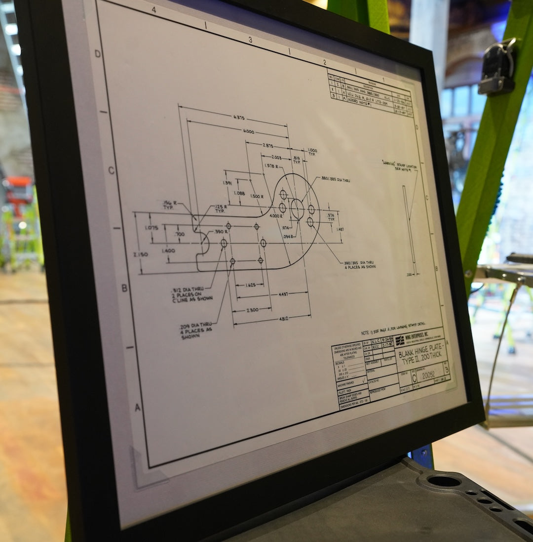 Computer screen displaying technical drawings and schematics.