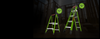 Two green Little Giant fiberglass ladders, a step stool and a King Kombo ladder, each with a “41% OFF” badge, standing in a dark building background